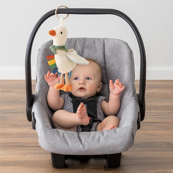 Itzy Ritzy Bitzy Traveler Car Seat & Stroller Toy for Babies – Developmental Sensory Toy Features Crinkle & Rattle Sounds & Multiple Textures – Hanging Travel Buddy for On-the-Go Entertainment (Goose)