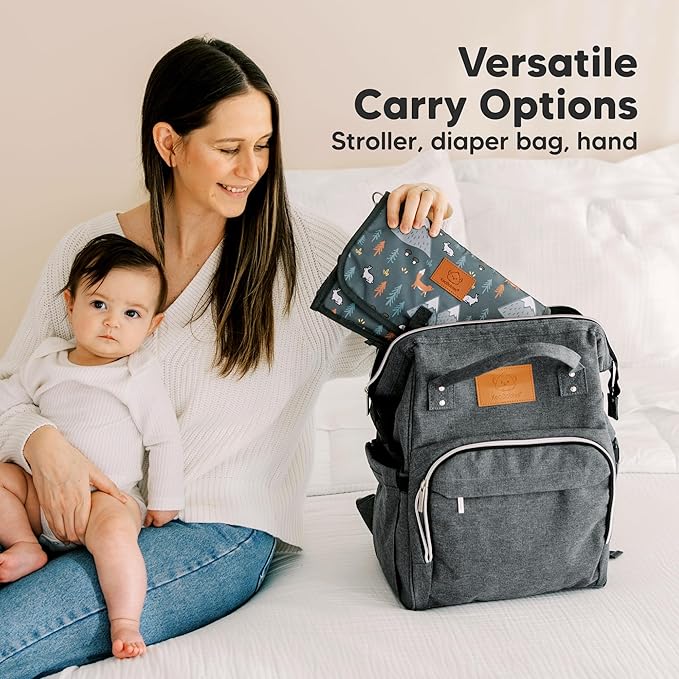 KeaBabies Portable Diaper Changing Pad - Large Waterproof Baby Changing Mat, Compact Travel Diaper Clutch, Functional Pockets Fit Newborn Essentials, Wipeable & Padded Baby Changer (Woods)